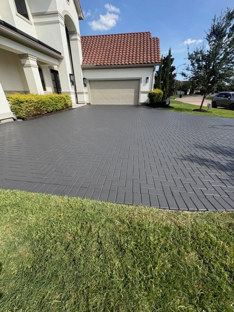Charcoal herringbone interlocking paver driveway by Quintana Stone